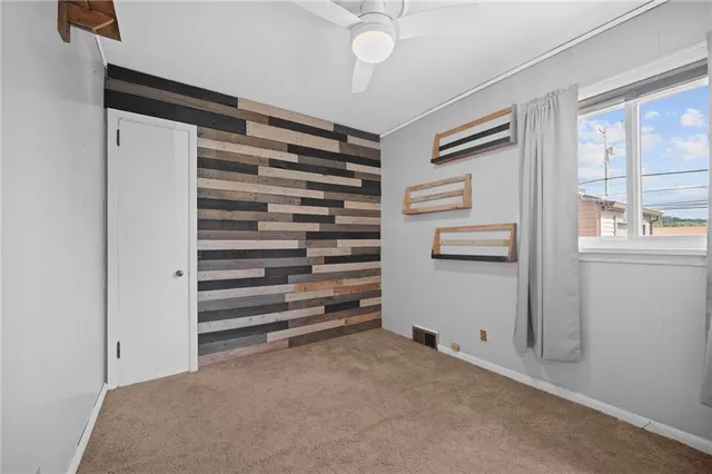 a view of room with closet and racks