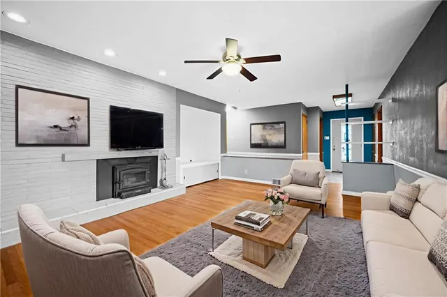 a living room with furniture and a flat screen tv