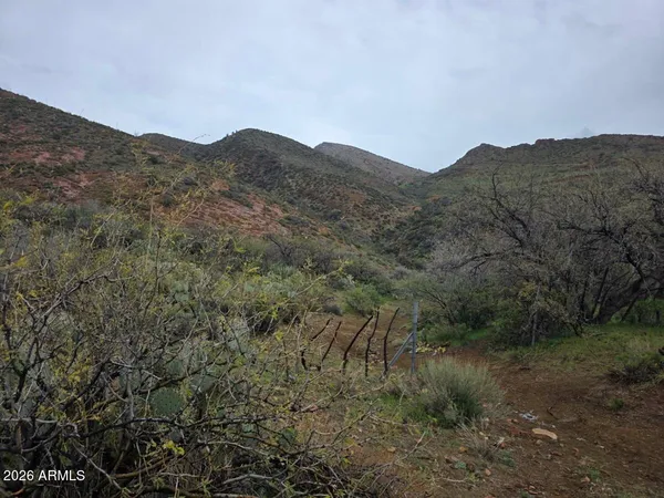 a view of a mountain range in a cloudy sky