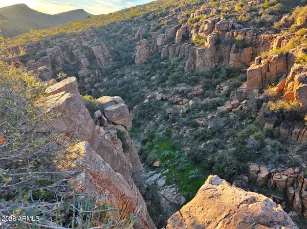 a view of a wooden house with a yard