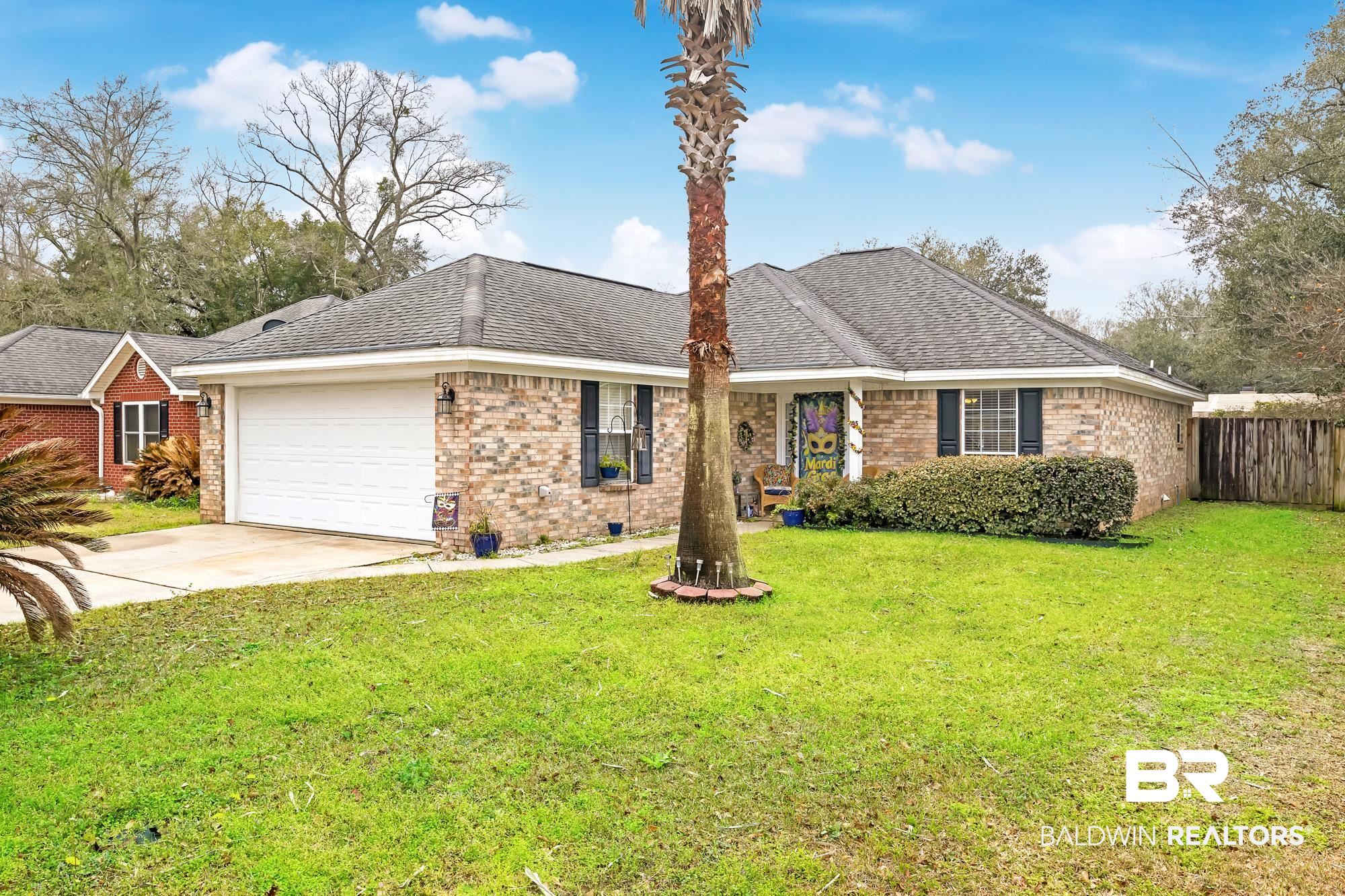 105 Cluster Oaks Court Foley, AL 36535 - Photo 2 of 26 Single story home with brick siding, driveway, an attached garage, and roof with shingles