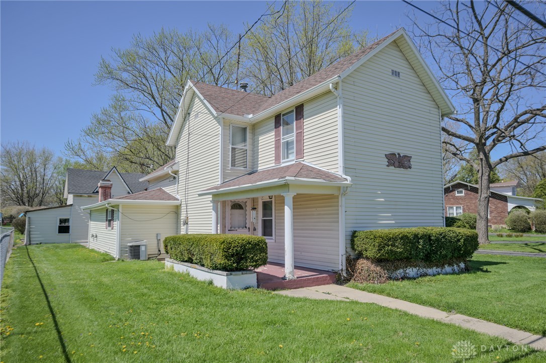 3057 Springfield Xenia Road Springfield, OH 45506 - Photo 2 of 37 This classic residence features a welcoming porch and well-maintained landscaping, creating an inviting curb appeal.