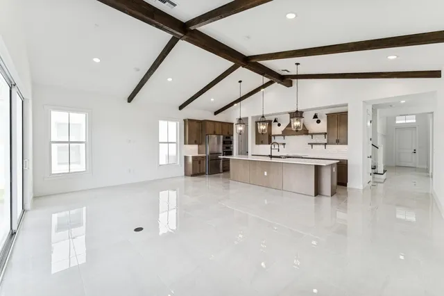 a bathroom with a double vanity sink toilet and shower
