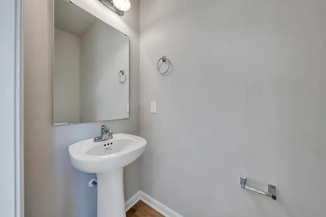 a bathroom with a sink and mirror