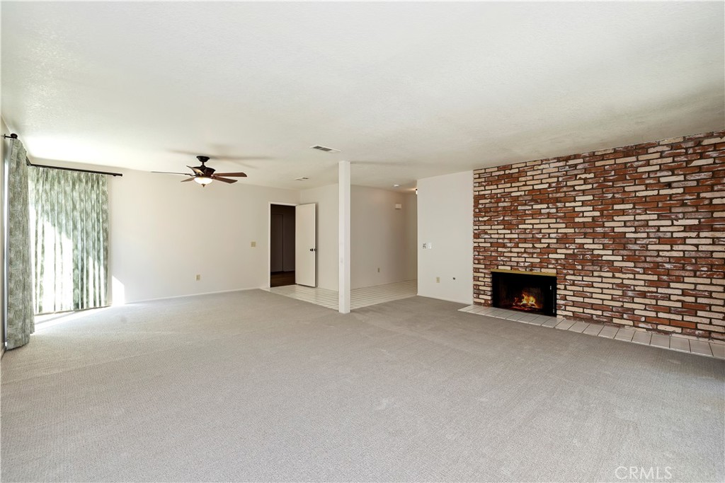 1440 Trenton Drive Riverside, CA 92506 - Photo 14 of 52 a view of an empty room with a fireplace