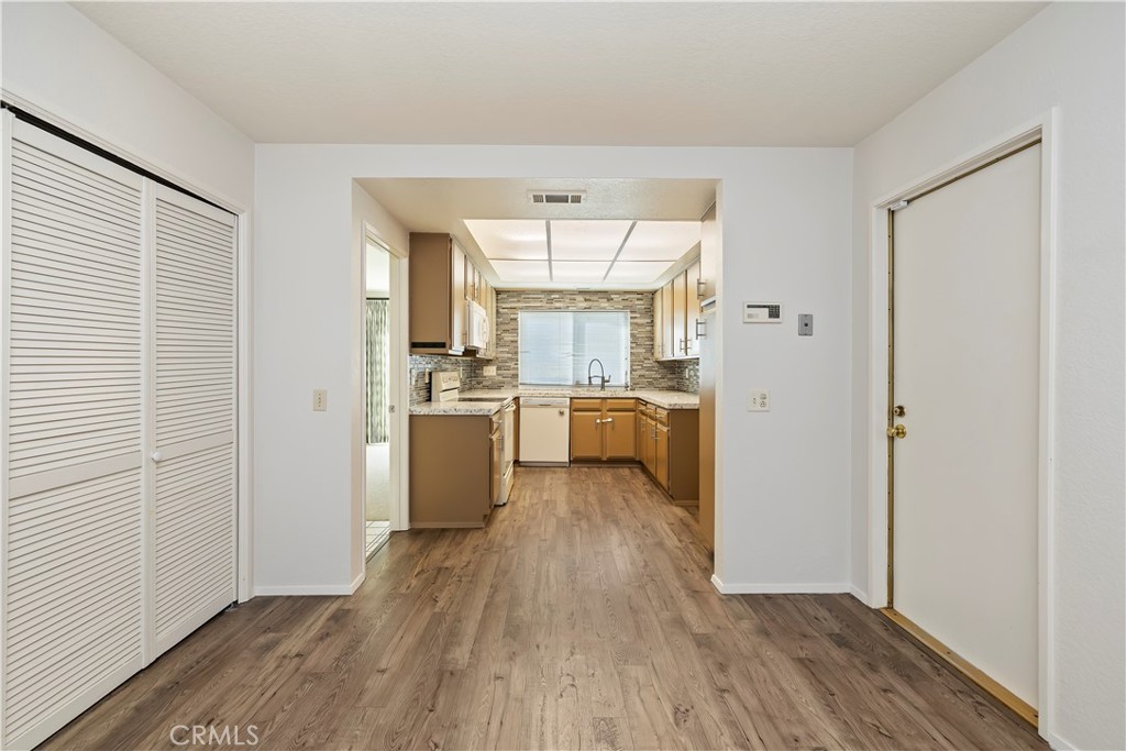 1440 Trenton Drive Riverside, CA 92506 - Photo 25 of 52 a view of a kitchen with a sink a refrigerator and window
