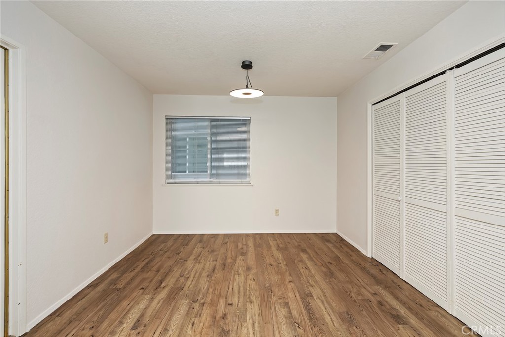 1440 Trenton Drive Riverside, CA 92506 - Photo 26 of 52 wooden floor in an empty room with a window