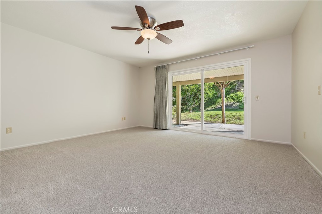 1440 Trenton Drive Riverside, CA 92506 - Photo 27 of 52 a view of a livingroom with a ceiling fan and window