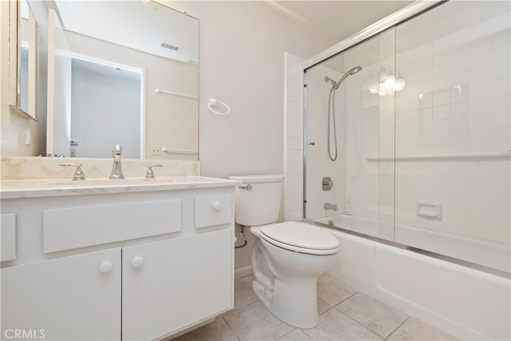 1440 Trenton Drive Riverside, CA 92506 - Photo 33 of 52 a bathroom with a sink a toilet and shower