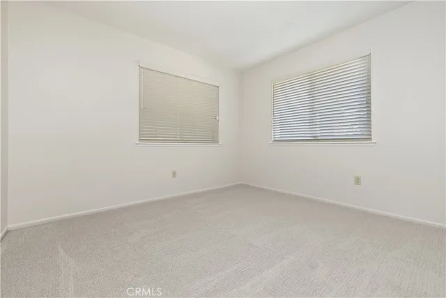 a view of a house with backyard and porch