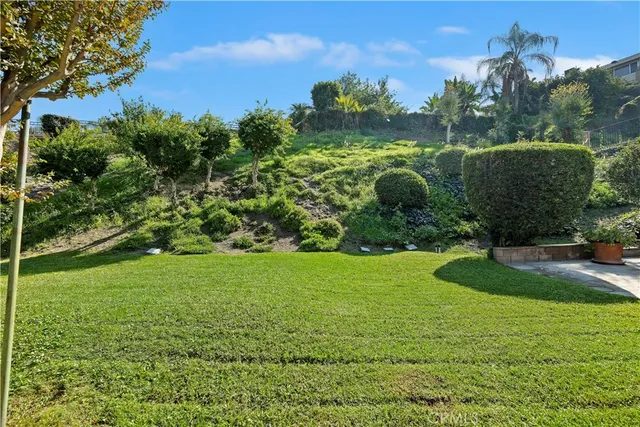 an aerial view of multiple houses with yard