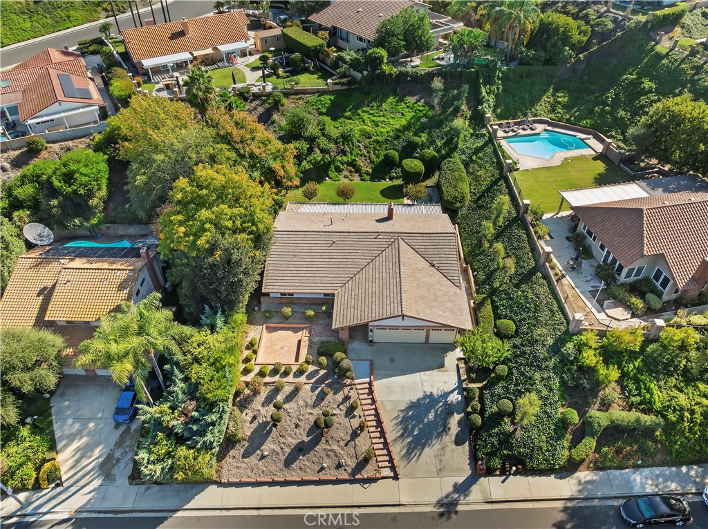 1440 Trenton Drive Riverside, CA 92506 - Photo 50 of 52 an aerial view of a house with a yard fire pit and outdoor seating