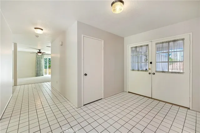 a view of empty room with wooden floor and fireplace