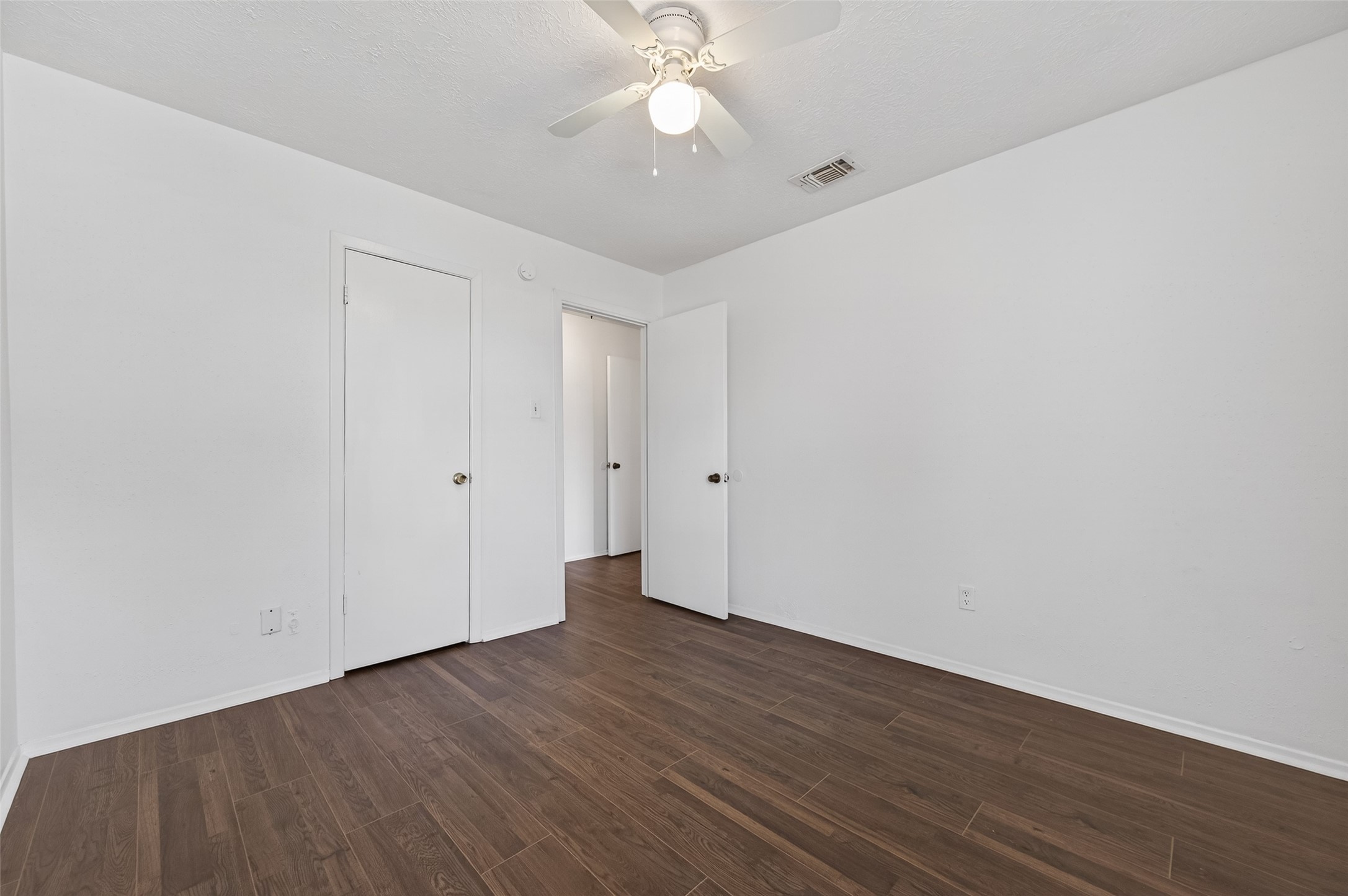 11718 Inga Lane Houston, TX 77064 - Photo 13 of 24 a view of an empty room with wooden floor