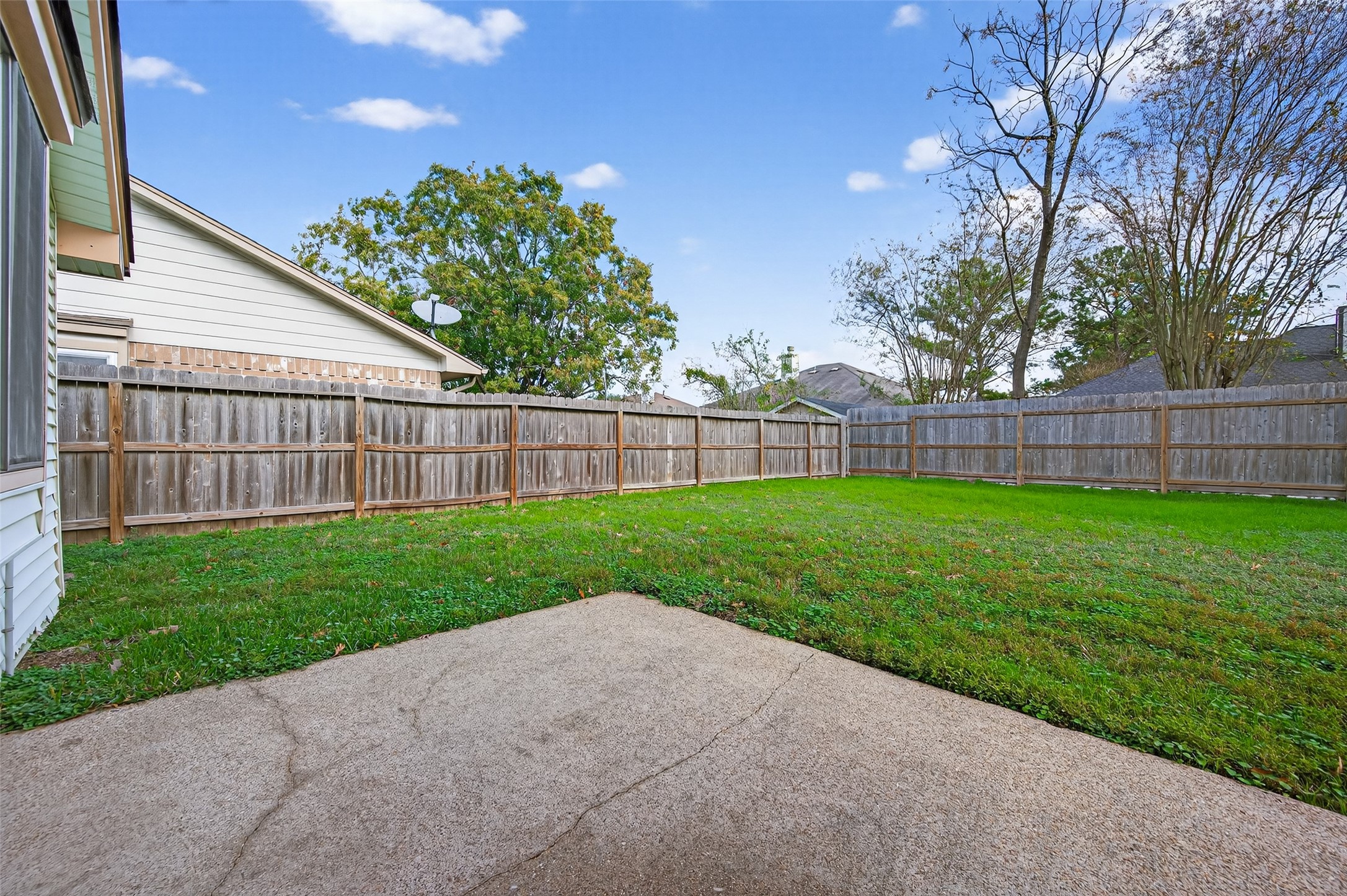 11718 Inga Lane Houston, TX 77064 - Photo 21 of 24 a view of a yard with a small yard and wooden fence