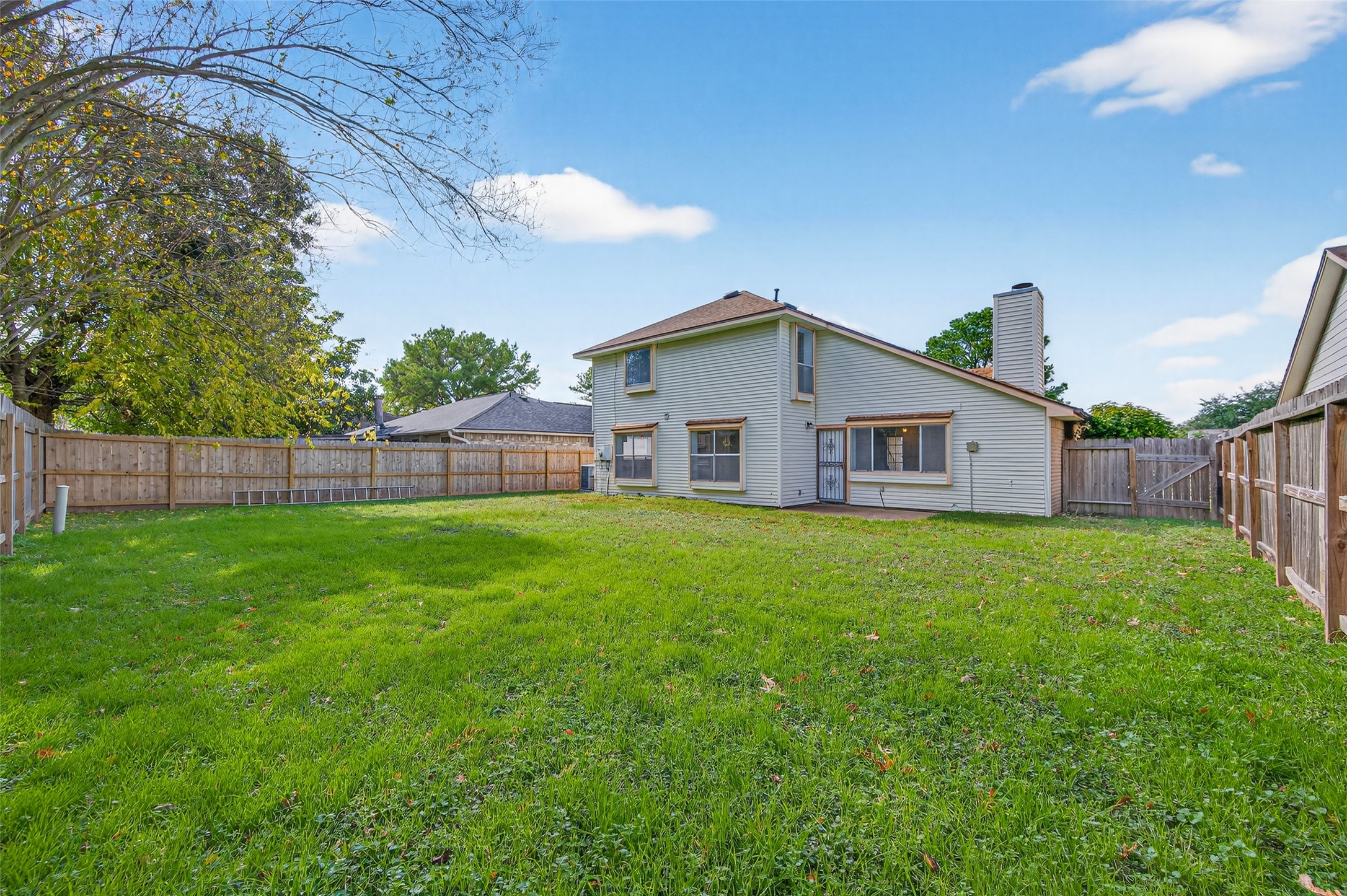11718 Inga Lane Houston, TX 77064 - Photo 24 of 24 a view of a yard with a house and garden