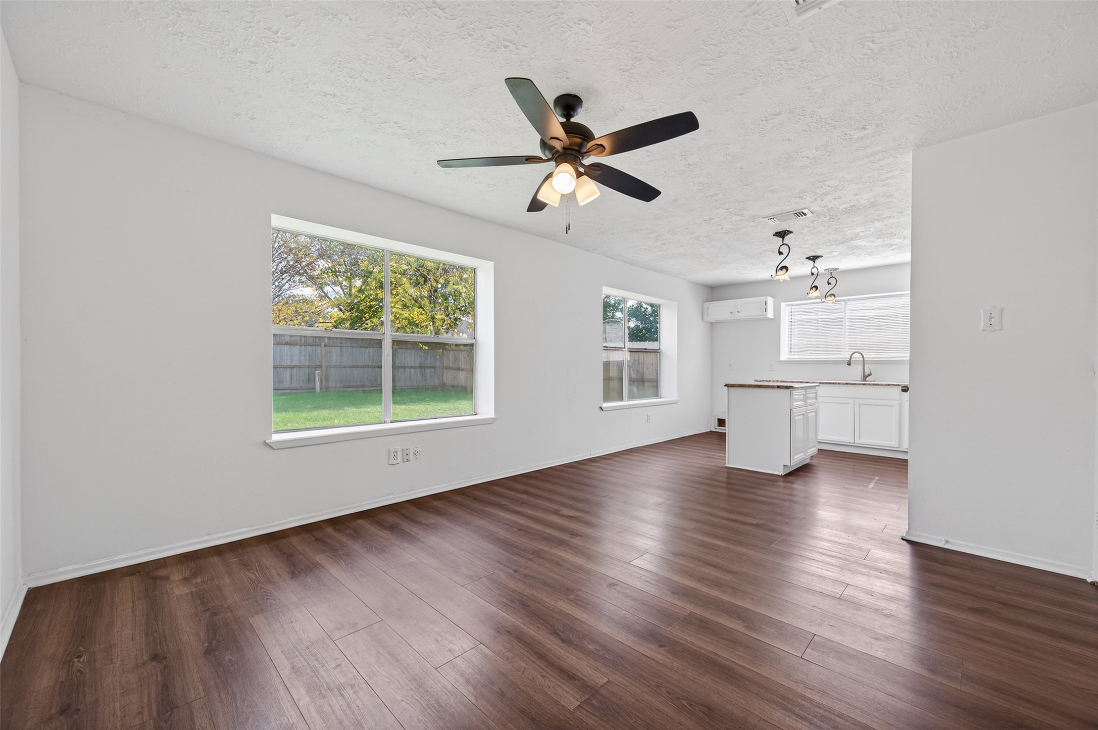 11718 Inga Lane Houston, TX 77064 - Photo 7 of 24 a view of empty room with wooden floor and window