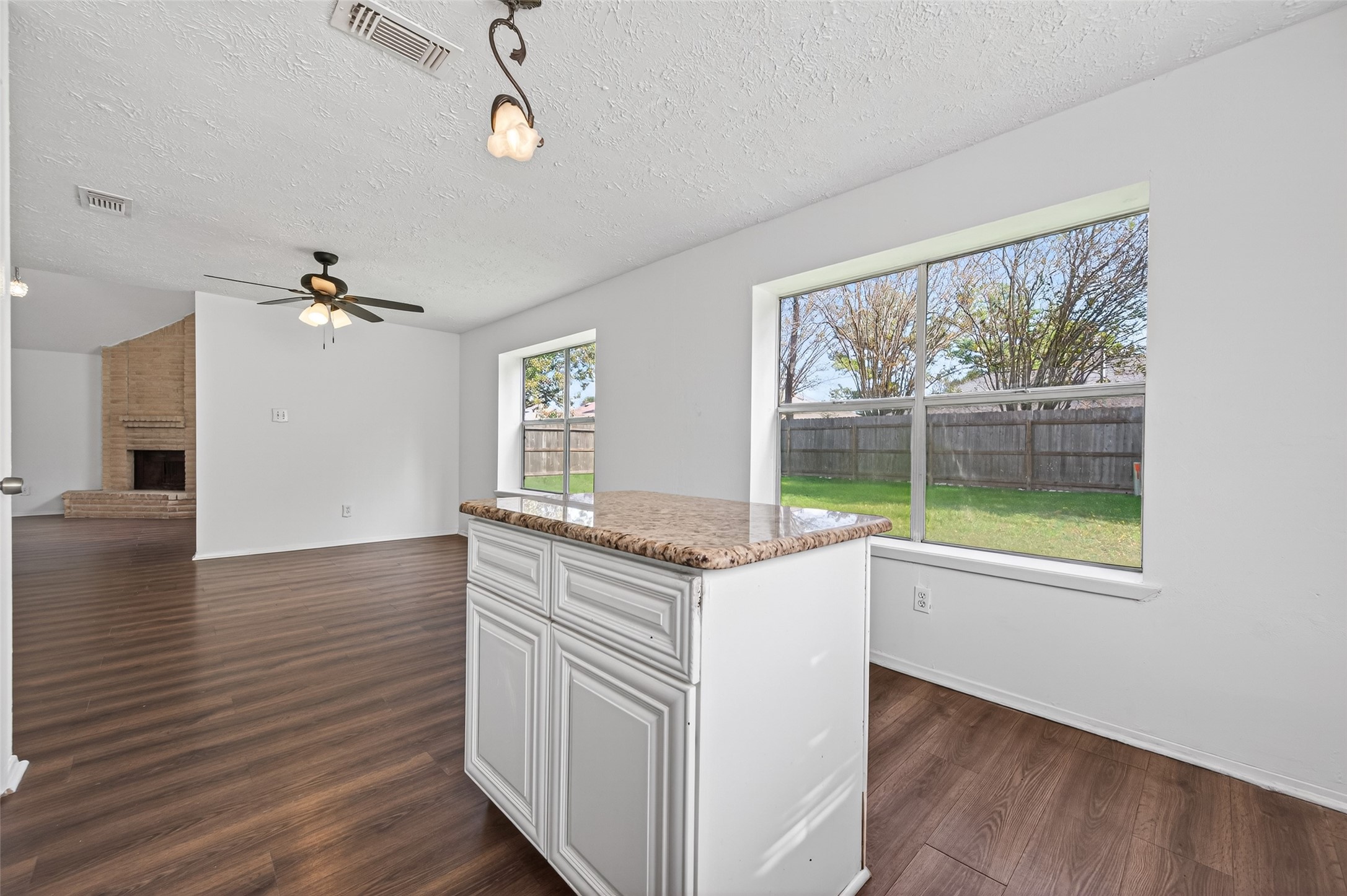 11718 Inga Lane Houston, TX 77064 - Photo 10 of 24 a kitchen with a stove and a large window