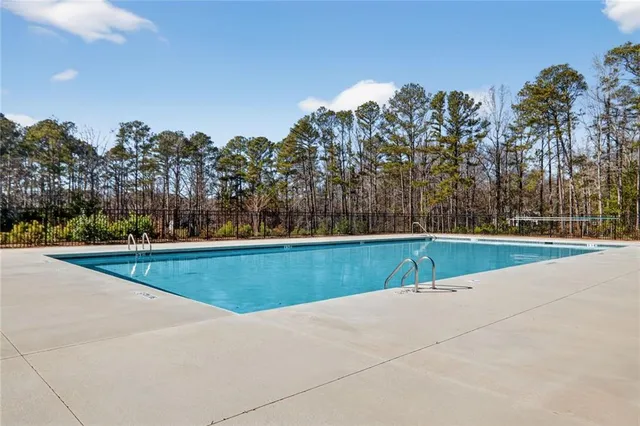 a view of swimming pool with an outdoor space and seating area
