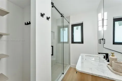 a bathroom with a sink and mirror