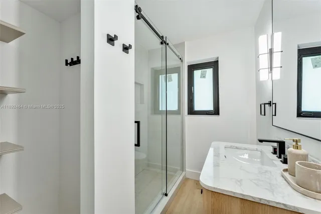 a bathroom with a sink and mirror