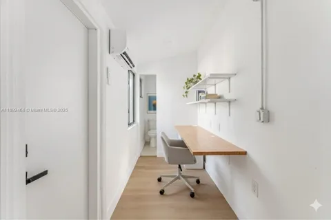 a view of a hallway with seating area