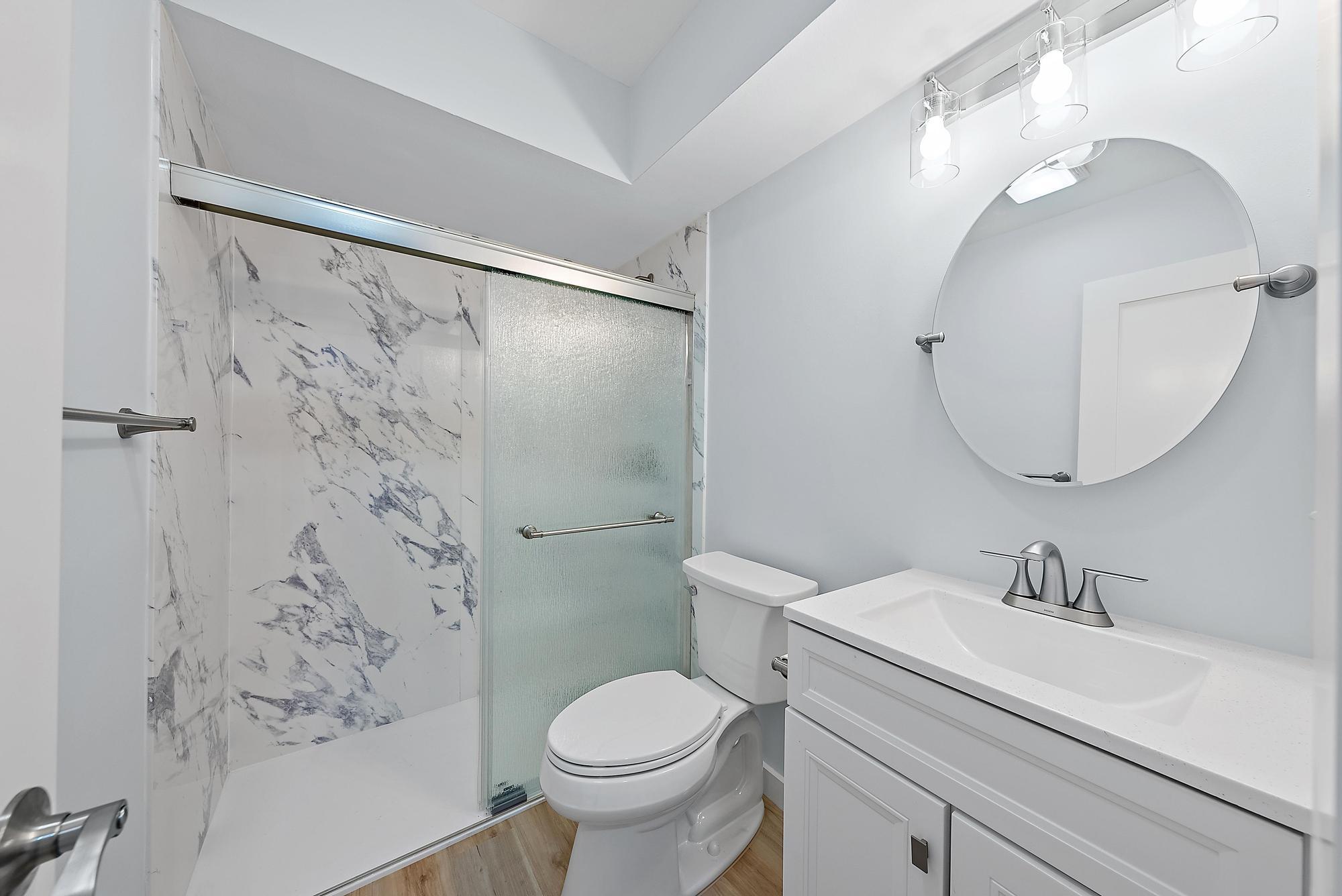 200 Anglers Circle Jupiter, FL 33458 - Photo 11 of 19 a bathroom with a sink toilet and shower