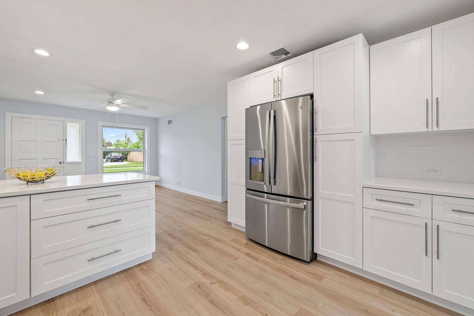 200 Anglers Circle Jupiter, FL 33458 - Photo 5 of 19 a kitchen with granite countertop cabinets and steel stainless steel appliances