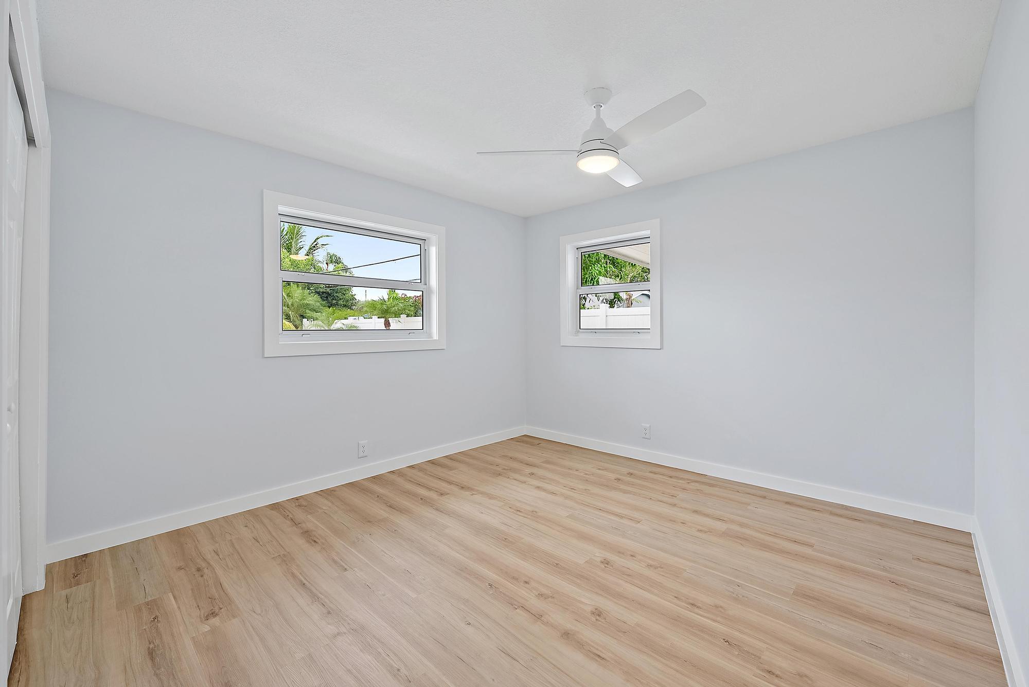 200 Anglers Circle Jupiter, FL 33458 - Photo 10 of 19 wooden floor in an empty room with a window