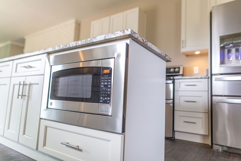 1017 Cairo Road Gallatin, TN 37066 - Photo 13 of 50 a kitchen with white cabinets and stainless steel appliances