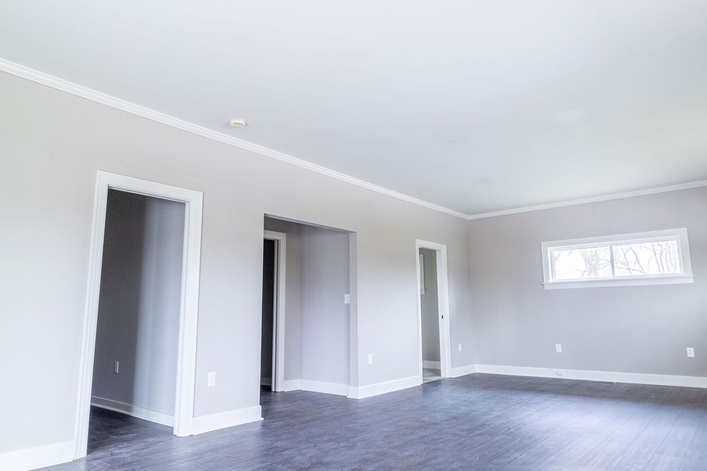 1017 Cairo Road Gallatin, TN 37066 - Photo 23 of 50 an empty room with wooden floor and windows