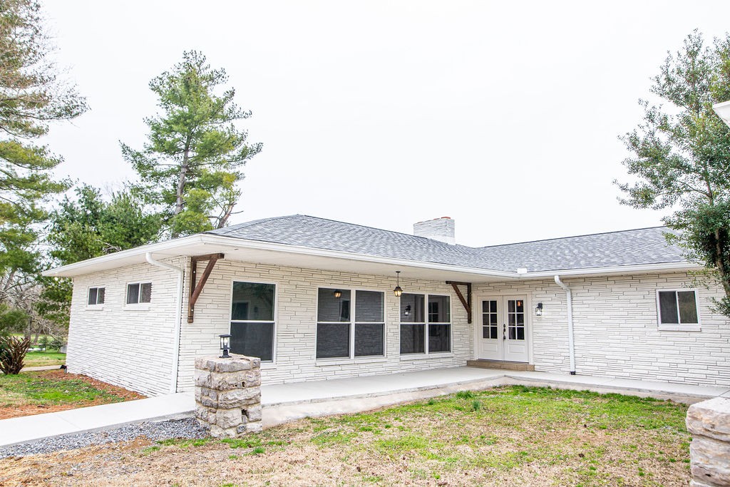 1017 Cairo Road Gallatin, TN 37066 - Photo 3 of 50 a front view of a house with a yard outdoor seating and garage