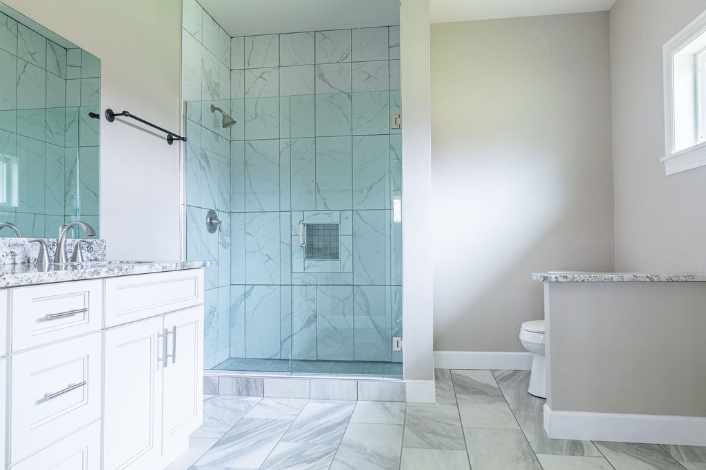 1017 Cairo Road Gallatin, TN 37066 - Photo 32 of 50 a bathroom with a granite countertop sink toilet and shower