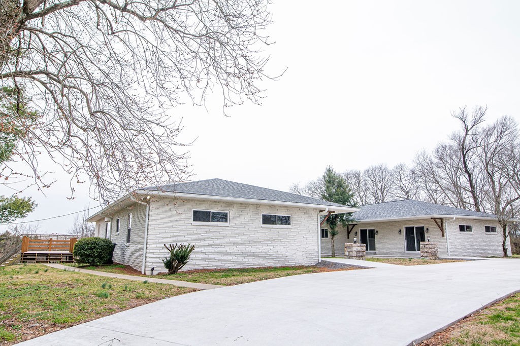 1017 Cairo Road Gallatin, TN 37066 - Photo 43 of 50 a front view of a house with a yard and garage