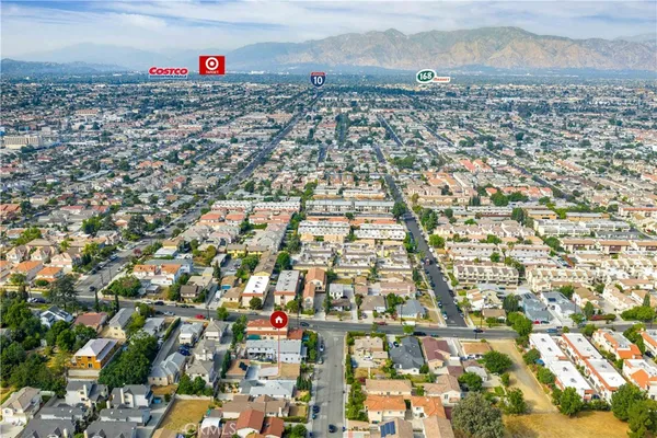 an aerial view of residential building and parking space