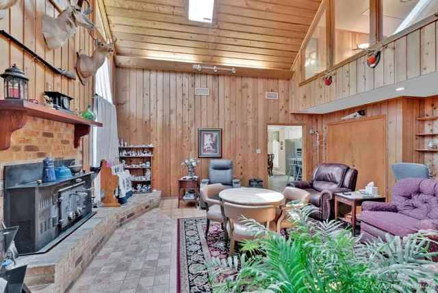 a backyard of a house with outdoor seating