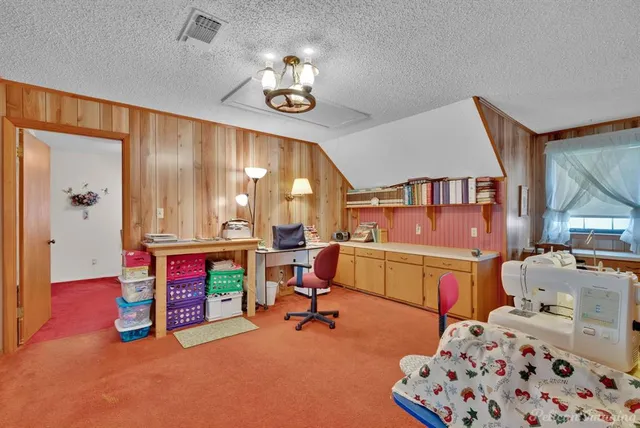 a bedroom with furniture and a window