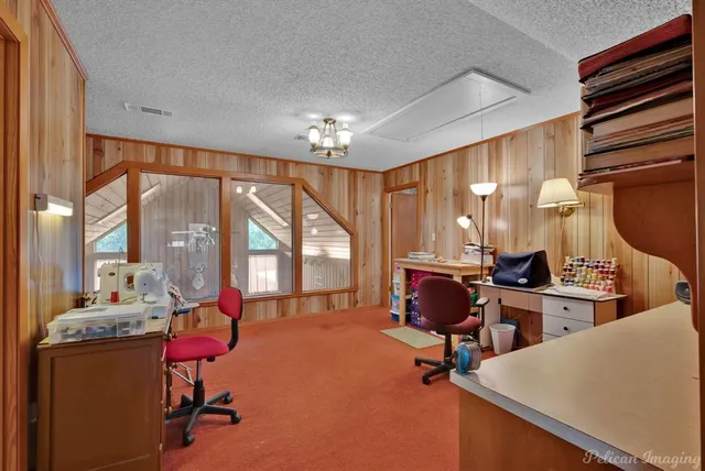 a room with gym equipment and a large window