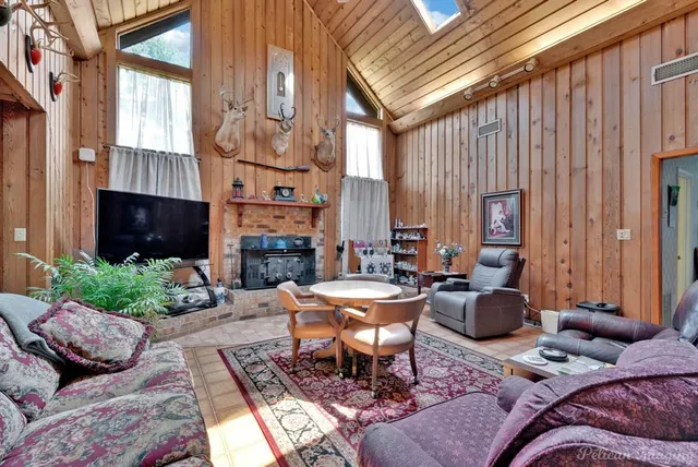 a view of a livingroom with furniture and a fireplace