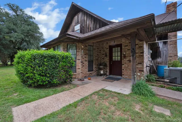 front view of a house with a small yard