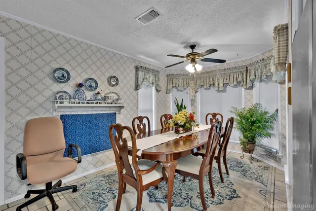 a dining room with furniture and window