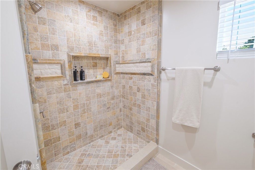 223 South Aprilia Avenue Compton, CA 90220 - Photo 22 of 46 a bathroom with a shower