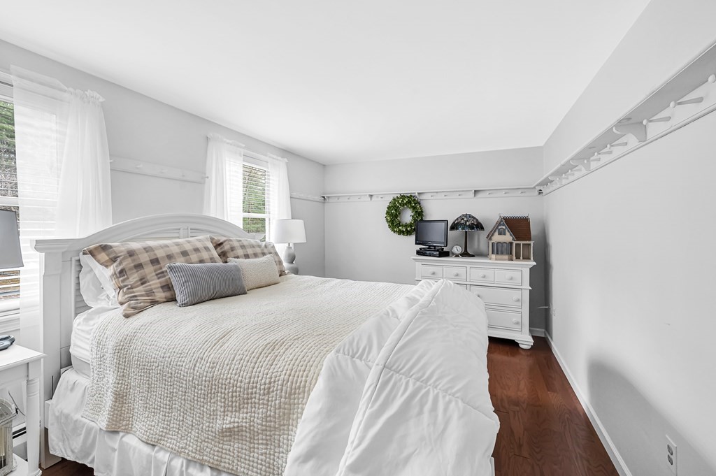 45 Scantic Road Hampden, MA 01036 - Photo 24 of 37 a bedroom with a large bed and wooden floor