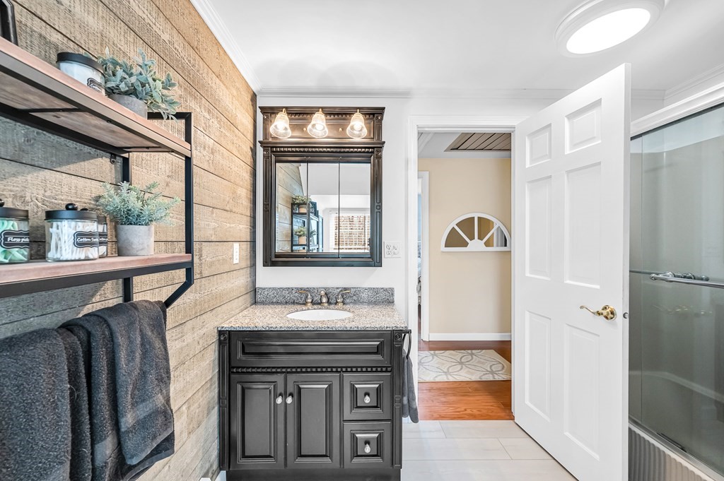45 Scantic Road Hampden, MA 01036 - Photo 26 of 37 a bathroom with a sink a mirror and a bathtub