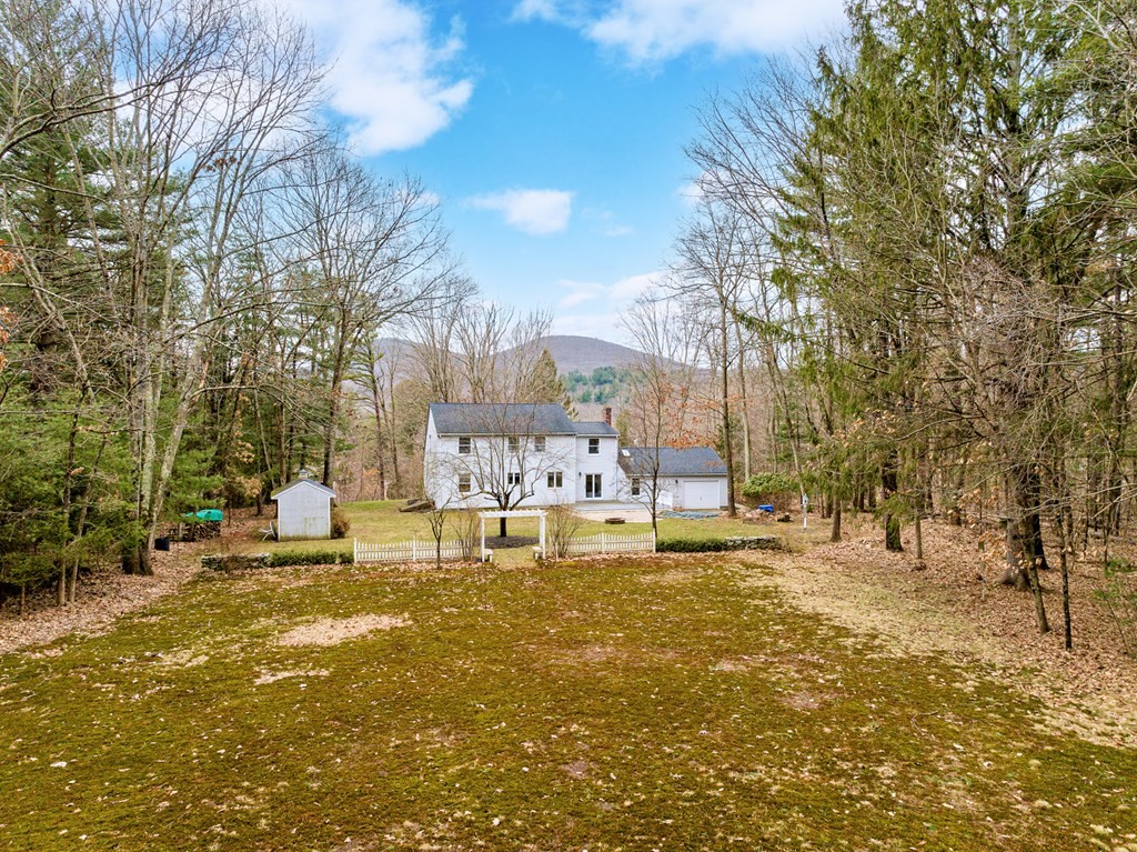 45 Scantic Road Hampden, MA 01036 - Photo 3 of 37 a view of a yard with a house in the background