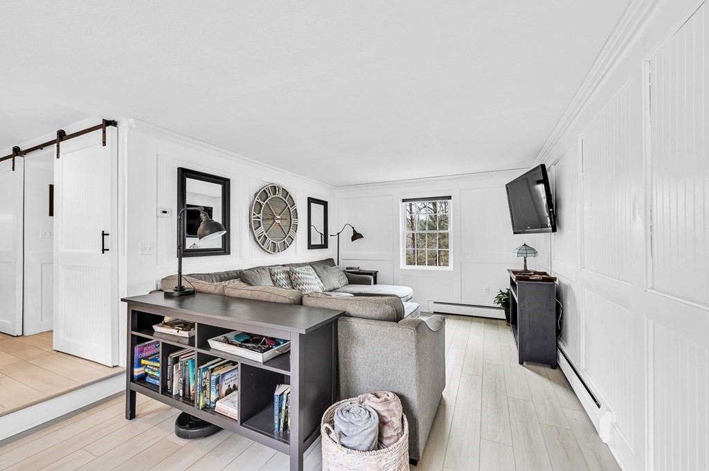 45 Scantic Road Hampden, MA 01036 - Photo 7 of 37 a view of a livingroom with furniture and a flat screen tv