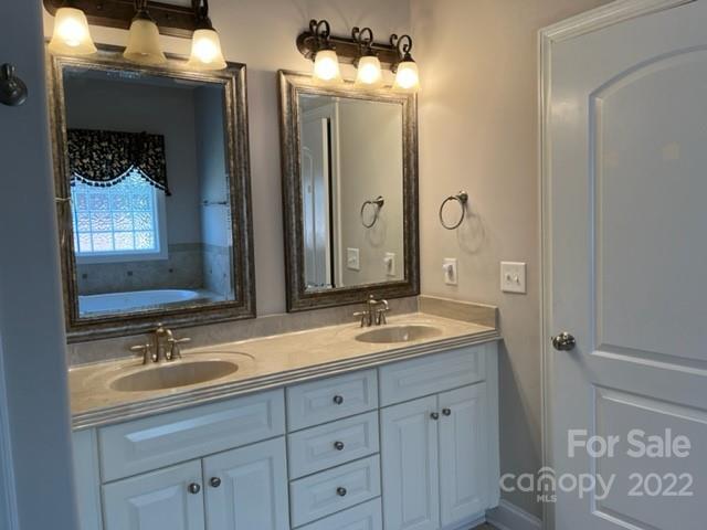 119 Blakemore Drive Shelby, NC 28152 - Photo 16 of 23 a bathroom with double sink and a mirror