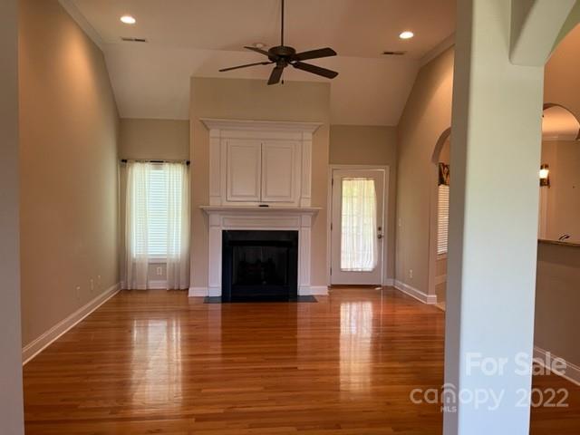 119 Blakemore Drive Shelby, NC 28152 - Photo 6 of 23 a view of empty room with wooden floor and a fireplace