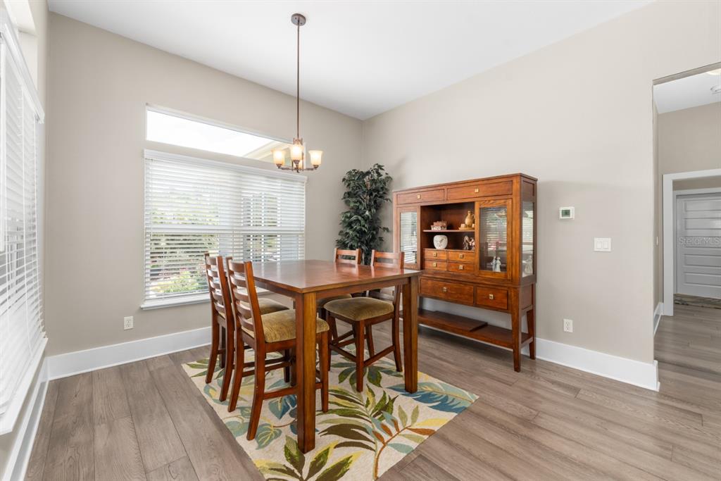1751 Southwest 188th Street Newberry, FL 32669 - Photo 26 of 93 a view of a dining room with furniture window and wooden floor