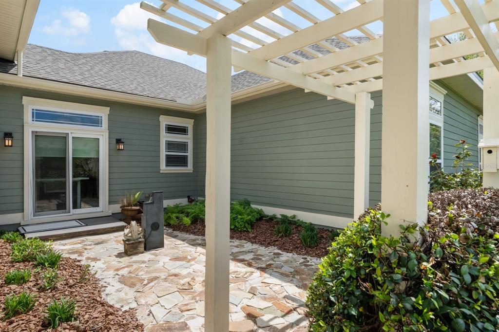 1751 Southwest 188th Street Newberry, FL 32669 - Photo 30 of 93 a house with potted plants in front of it